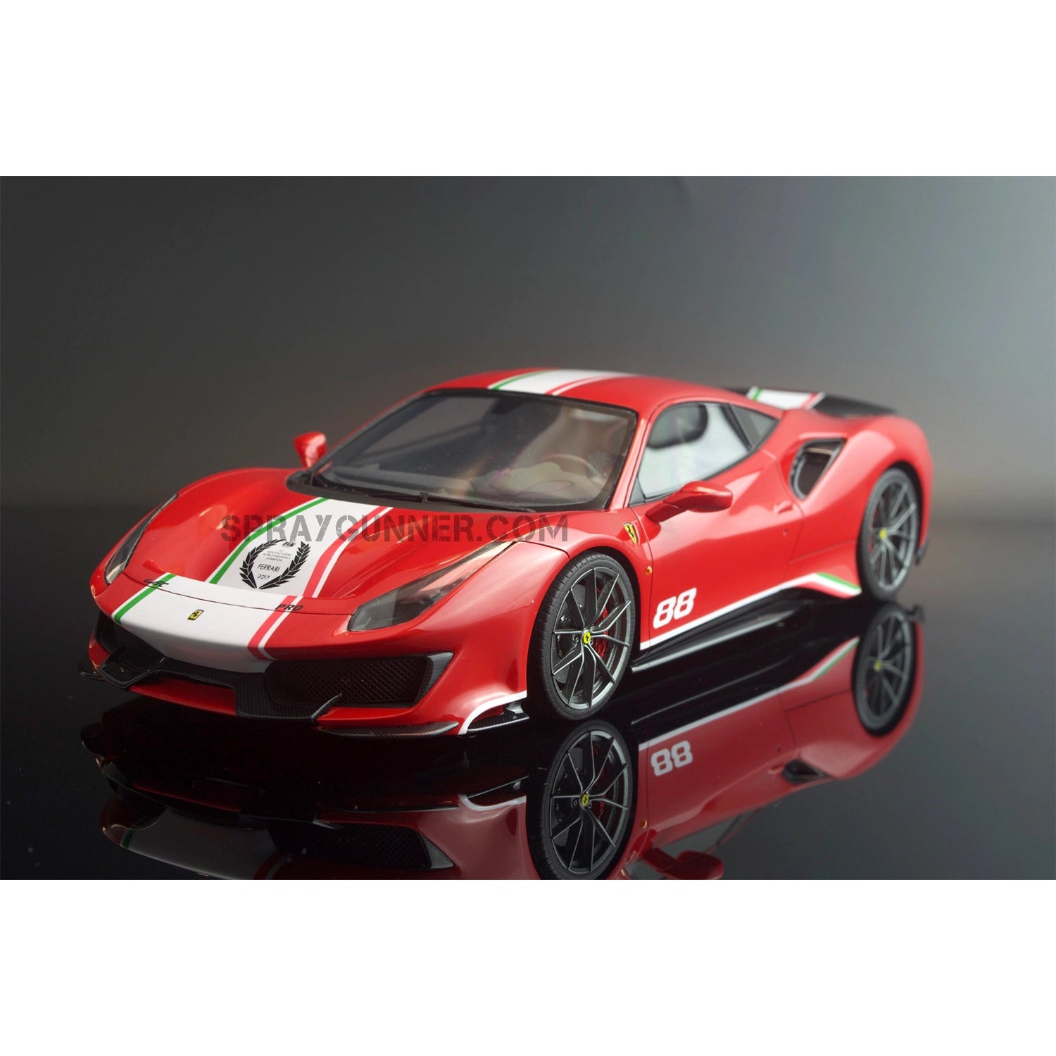 The ALPHA MODEL 1/24 scale model vehicle kit is a highly accurate recreation of the Ferrari 488 Pista with racing stripes and a red exterior.