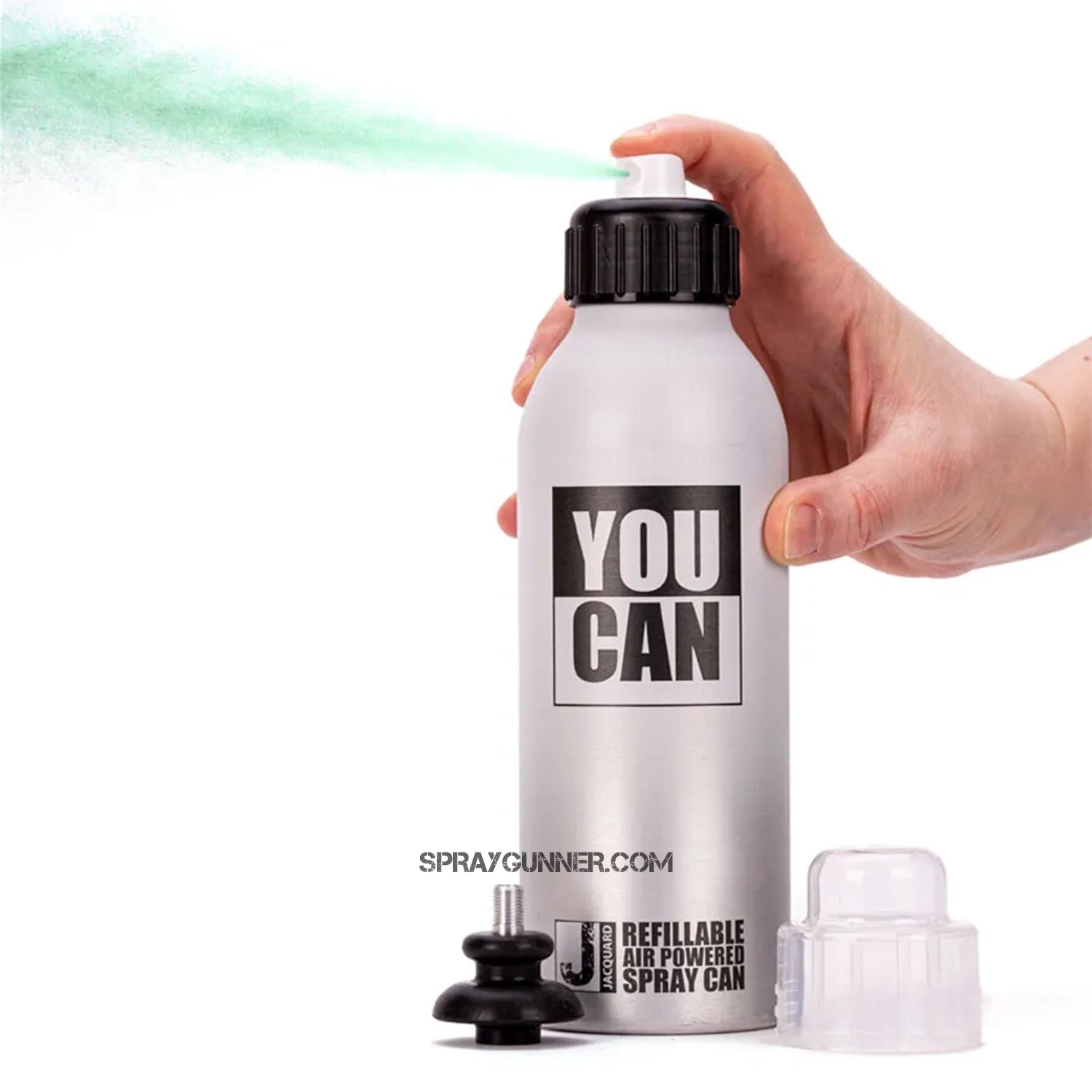 Hand using YouCAN by Jacquard Refillable Air Powered Spray Can to spray green mist. Versatile and refillable for multiple liquid applications.