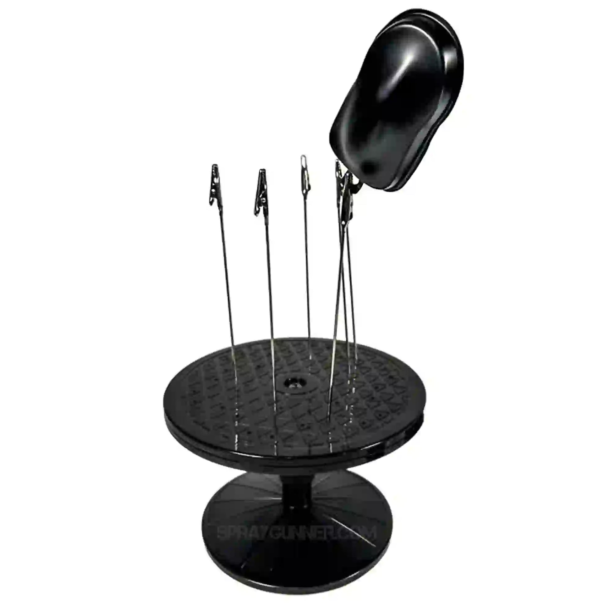 Airbrushing tool kit featuring a rotating stand with clamps holding a black speedshape. Perfect for miniature and model detailing with precision.
