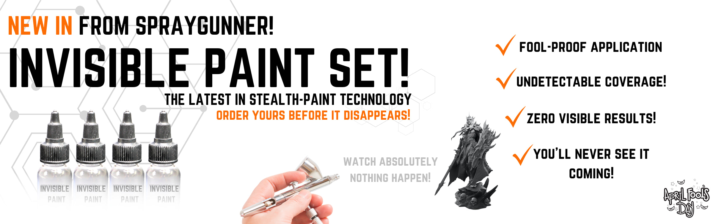 SprayGunner April Fools Invisible Paint Set website banner featuring four empty paint bottles, an airbrush, and a miniature figure. Text reads: The latest in stealth-paint technology. Order yours before it disappears!