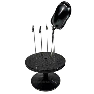 Airbrushing tool kit featuring a rotating stand with clamps holding a black speedshape. Perfect for miniature and model detailing with precision.
