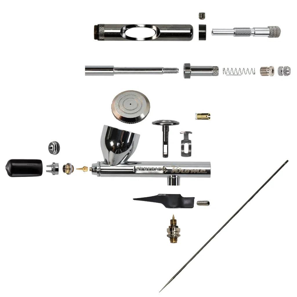 Disassembled Badger Renegade Krome airbrush parts kit for cleaning and maintenance, featuring the dual-action trigger, fine detail needle, and spray regulator.