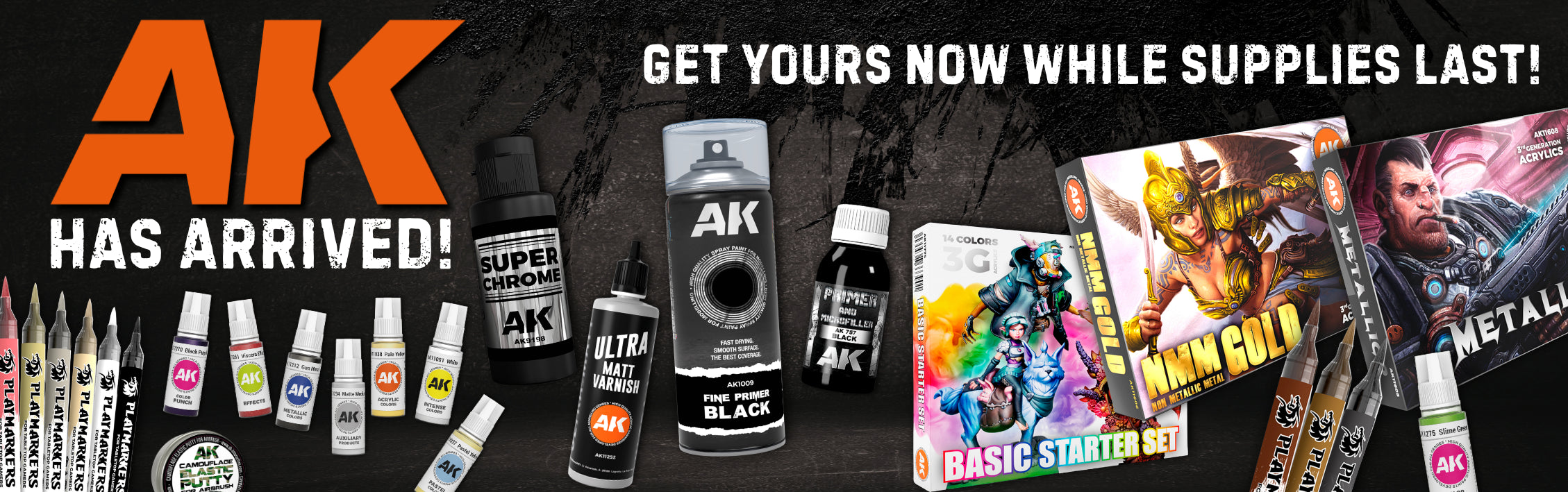 AK Interactive modeling supplies and hobby paints including acrylic sets, primers, varnishes, and markers on a black background.