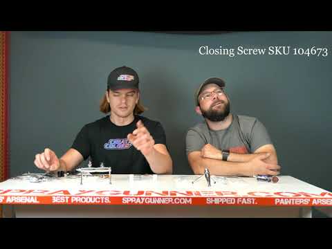 Harder and Steenbeck Evolution design modular airbrush holder system with integrated air hoses on a professional hobby workbench.